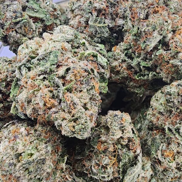 Bruce Banner cannabis buds with frosted resin, citrusy flavor, and energizing effects for mental clarity and physical relief.